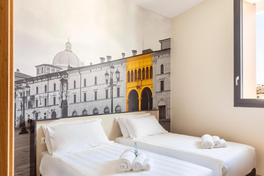 Postel nebo postele na pokoji v ubytování B&B Hotel Brescia