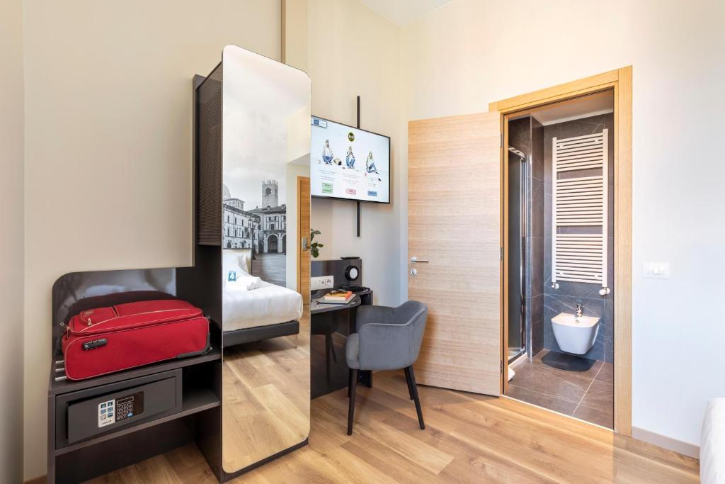 Postel nebo postele na pokoji v ubytování B&B Hotel Brescia