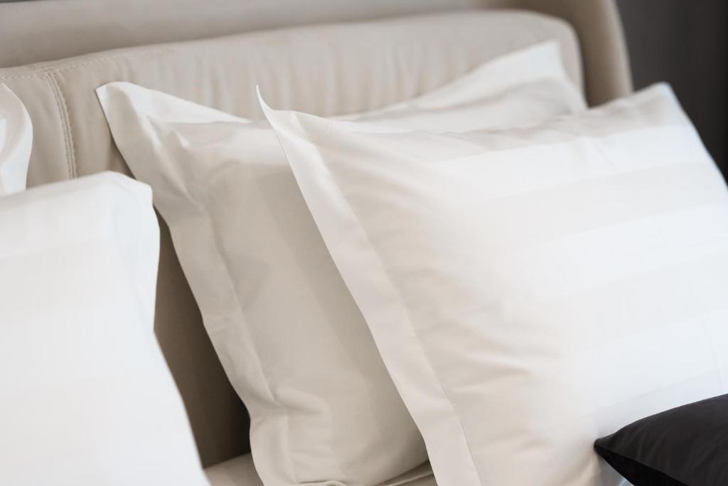 Postel nebo postele na pokoji v ubytování Naos Luxury Hotel