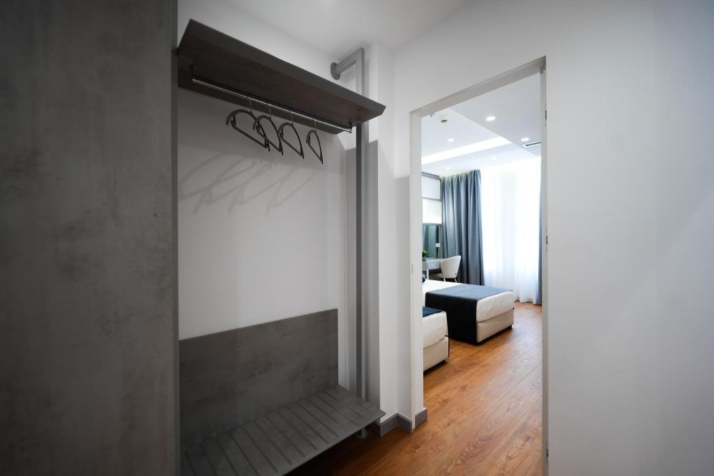 Postel nebo postele na pokoji v ubytování Naos Luxury Hotel