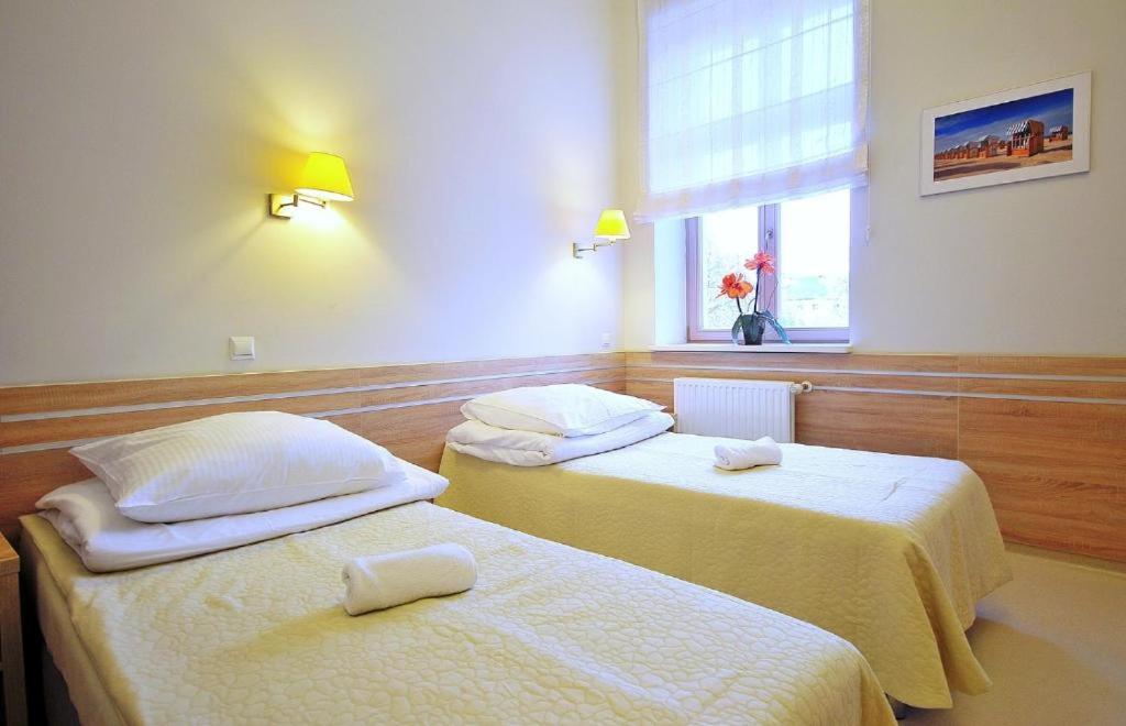 Postel nebo postele na pokoji v ubytování Sanatorium Mewa