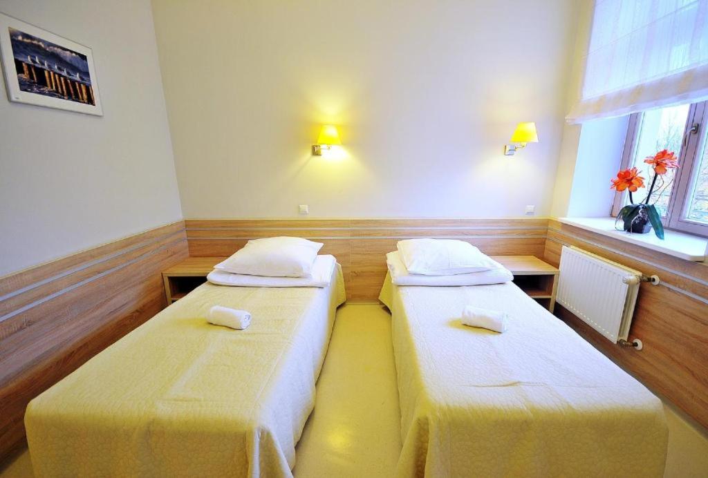 Postel nebo postele na pokoji v ubytování Sanatorium Mewa