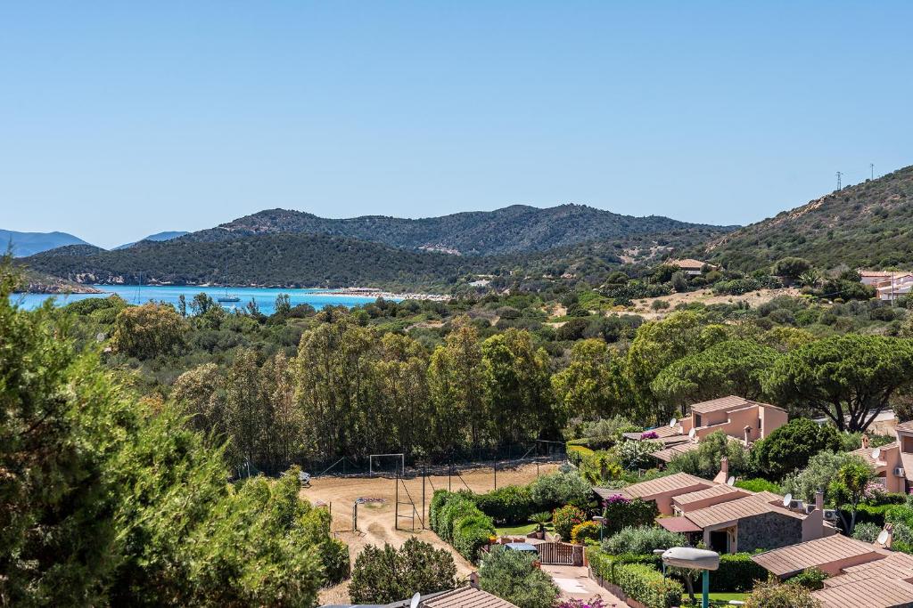 a view of a town with trees and a lake at Villa Perdalonga, Vista Mare Sea View Tuerredda in Teulada