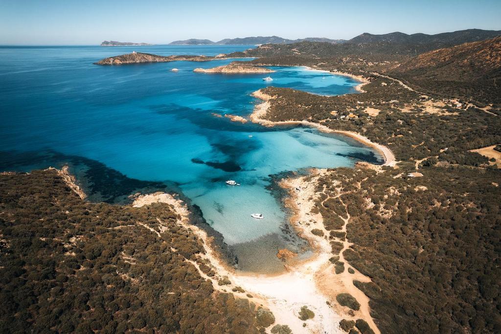 an aerial view of a beach and the ocean at Villa Perdalonga, Vista Mare Sea View Tuerredda in Teulada