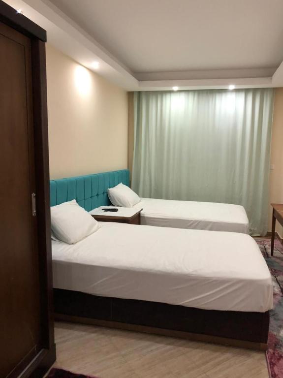 Postel nebo postele na pokoji v ubytování Cecelia Resort Hurghada