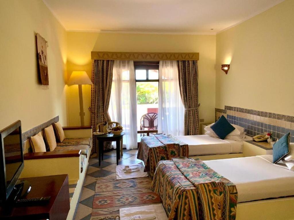 Postel nebo postele na pokoji v ubytování Tropitel Dahab Oasis