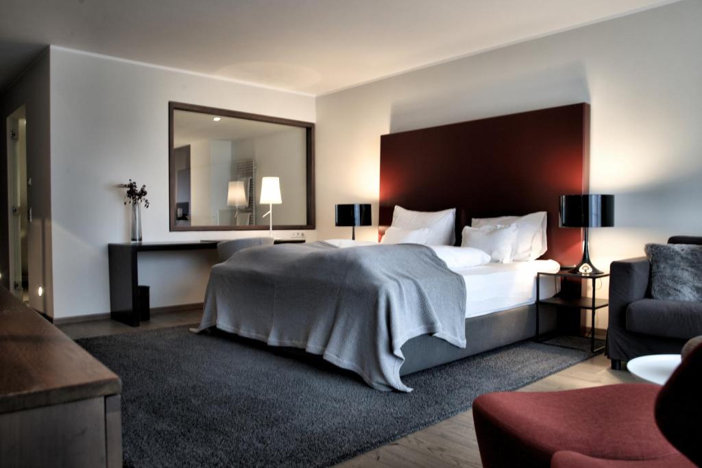 Postel nebo postele na pokoji v ubytování Hotel Madlein