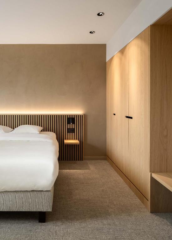 Postel nebo postele na pokoji v ubytování Hotel Chamade