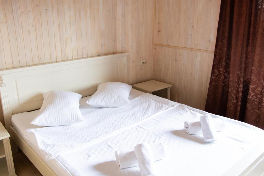 Postel nebo postele na pokoji v ubytování AMBASSADOR