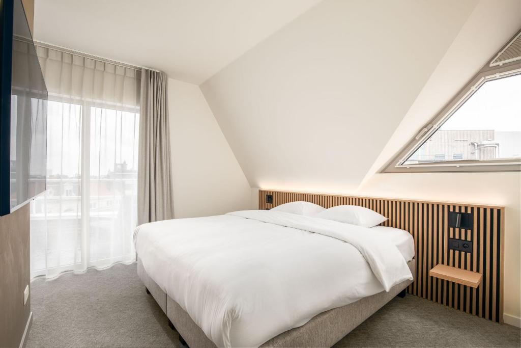 Postel nebo postele na pokoji v ubytování Hotel Chamade