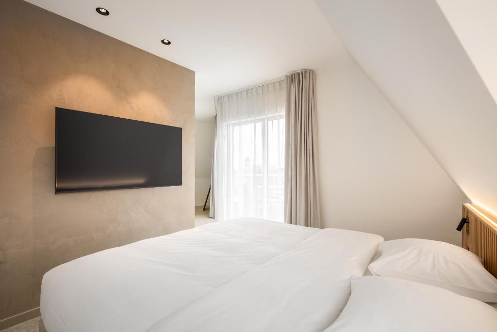 TV a/nebo společenská místnost v ubytování Hotel Chamade