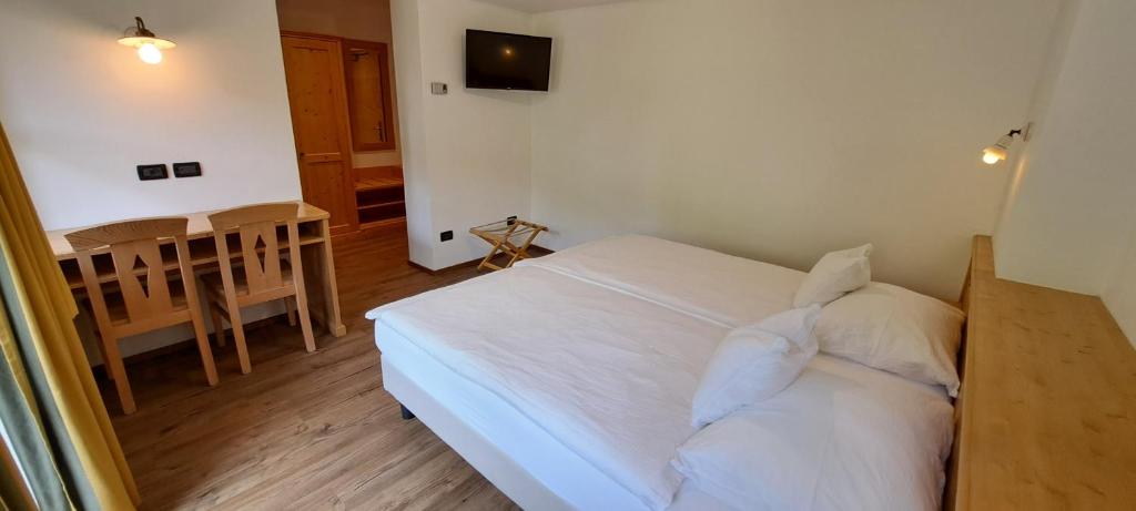 A bed or beds in a room at La Campagnola