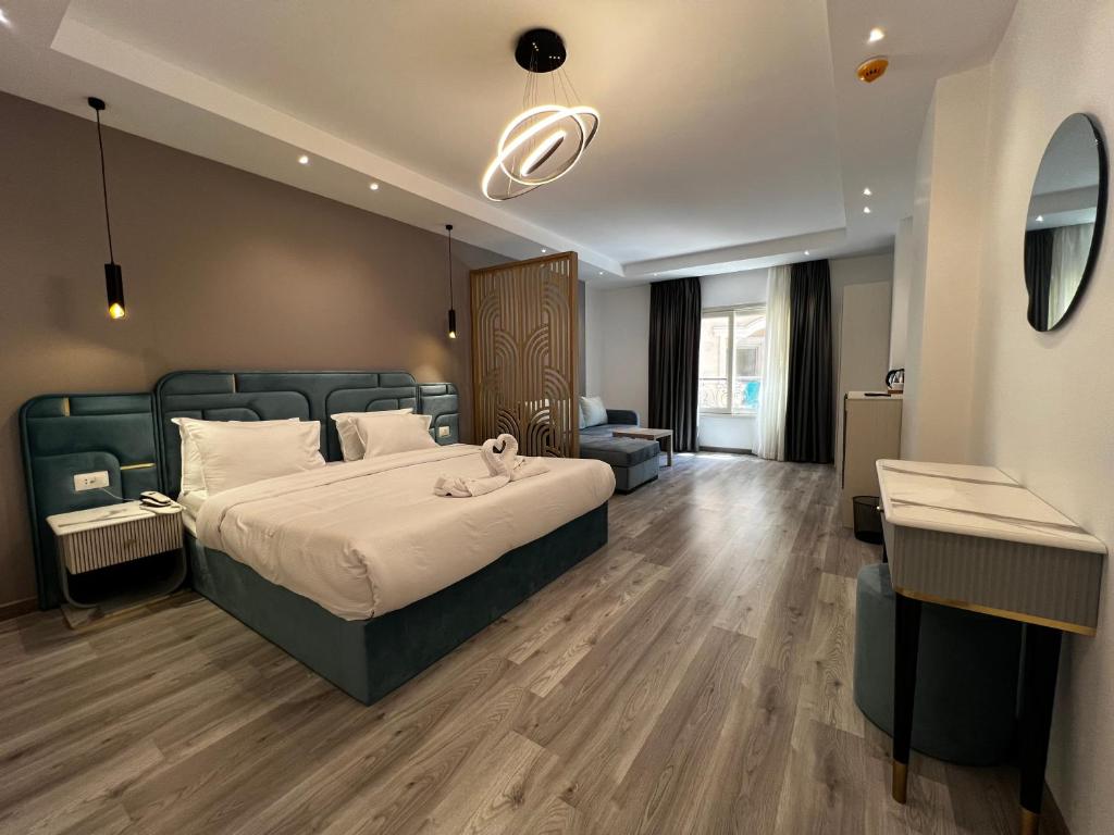 Postel nebo postele na pokoji v ubytování Onyx Pyramids Boutique Hotel