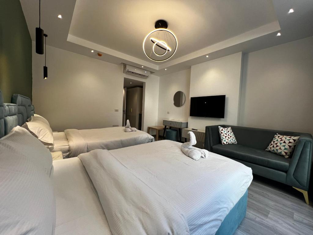 Postel nebo postele na pokoji v ubytování Onyx Pyramids Boutique Hotel