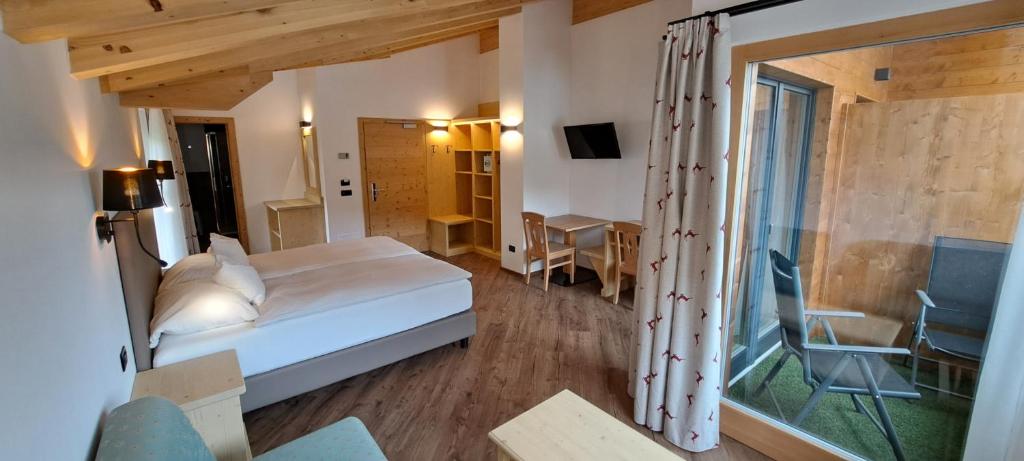 A bed or beds in a room at La Campagnola