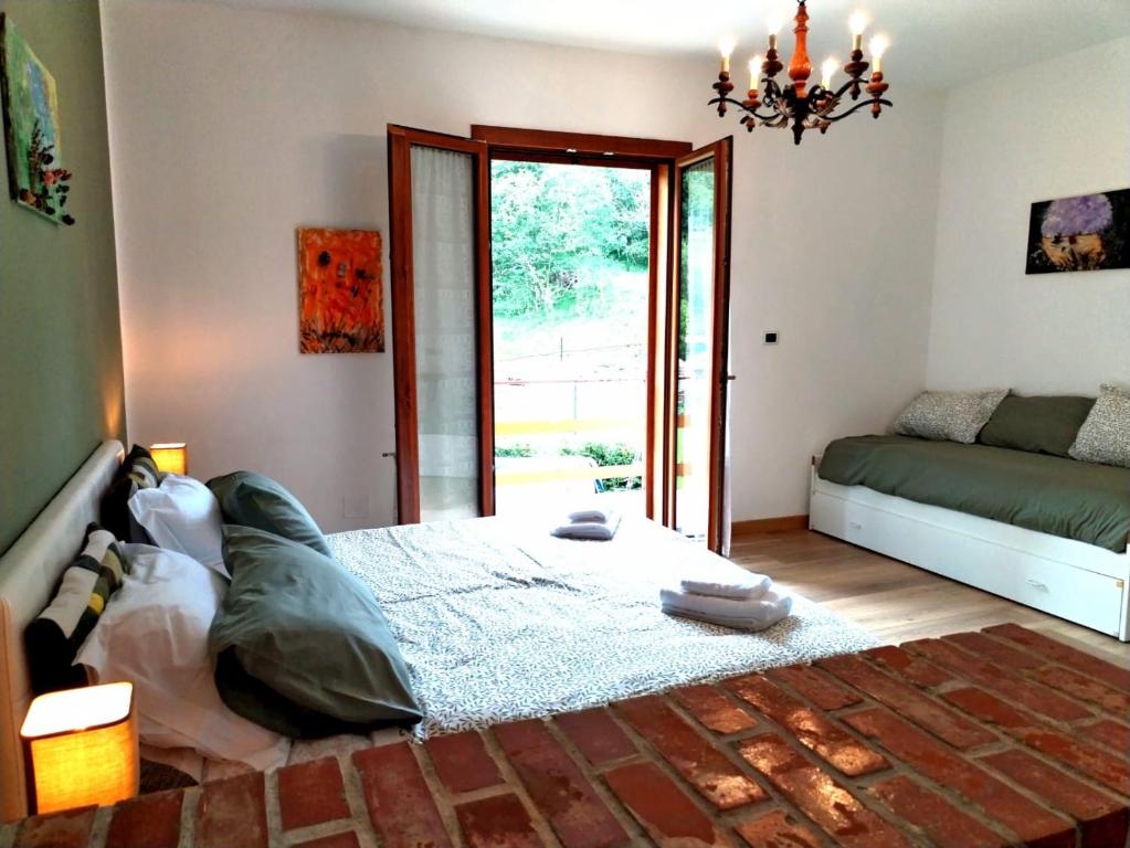Łóżko lub łóżka w pokoju w obiekcie Green Riviera Case Vacanza