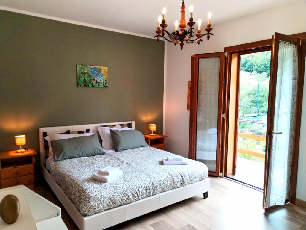 Łóżko lub łóżka w pokoju w obiekcie Green Riviera Case Vacanza