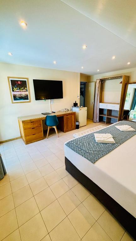 Postel nebo postele na pokoji v ubytování Hôtel Coco Island