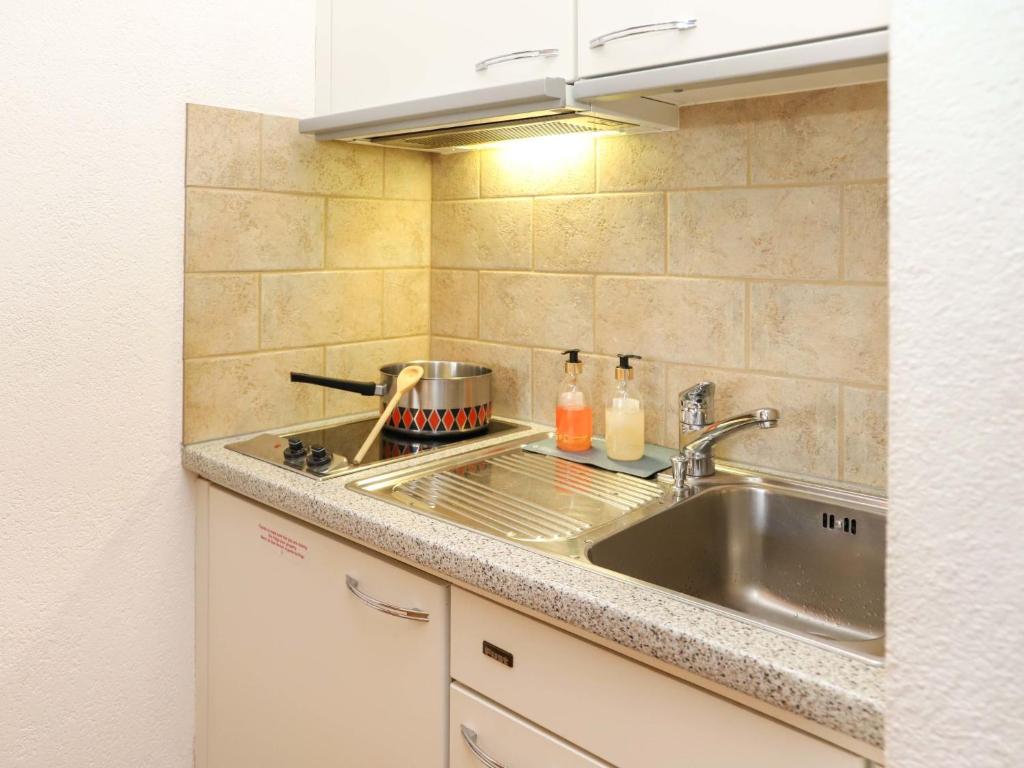 Kuchyň nebo kuchyňský kout v ubytování Apartment Vert Pré 3 by Interhome