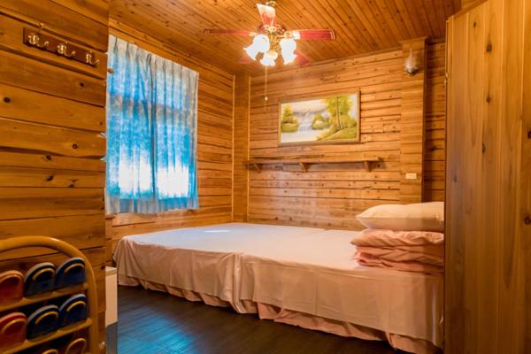 Postel nebo postele na pokoji v ubytování Xiangquan Leisure B&B