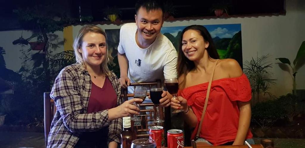 a group of three people posing for a picture at Tam Coc Paradise Homestay in Ninh Binh