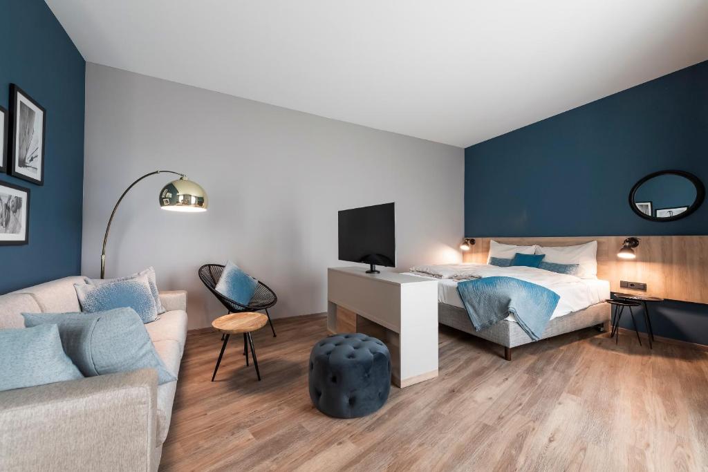 Postel nebo postele na pokoji v ubytování HARBR. hotel Heilbronn