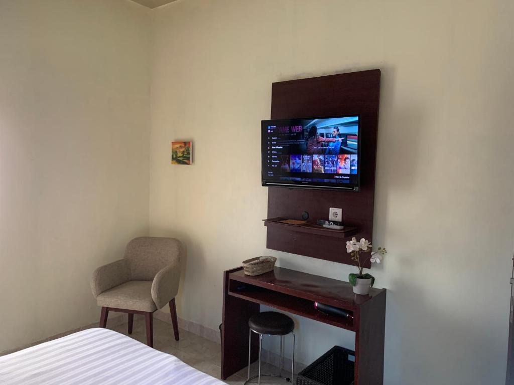 TV a/nebo společenská místnost v ubytování Cozy Palm Villa