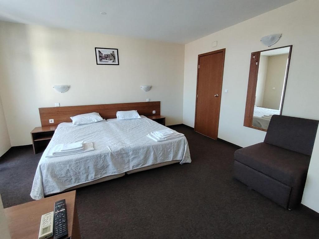 Postel nebo postele na pokoji v ubytování Sandor Hotel
