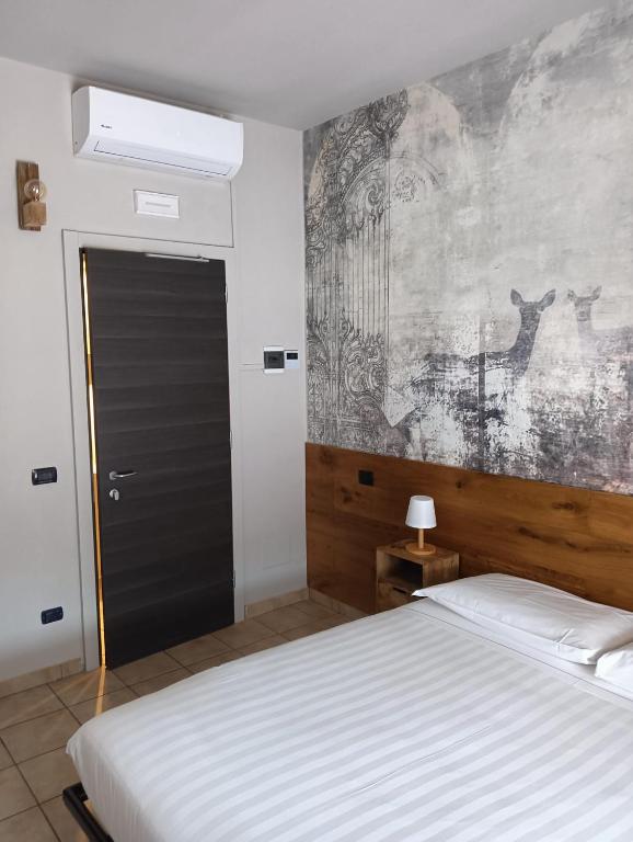 Postel nebo postele na pokoji v ubytování Locanda Da I Baldi