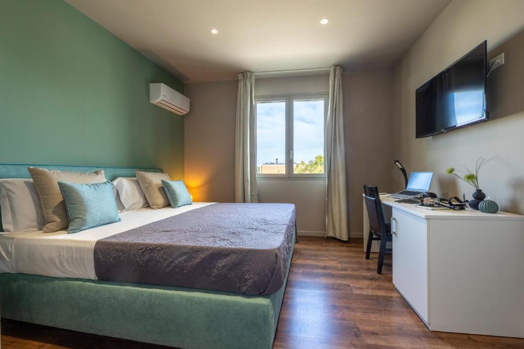 Postel nebo postele na pokoji v ubytování Baitan Hotel