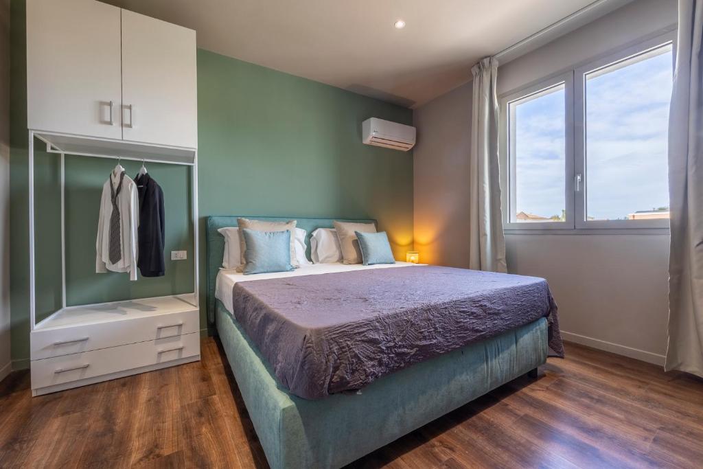 Postel nebo postele na pokoji v ubytování Baitan Hotel