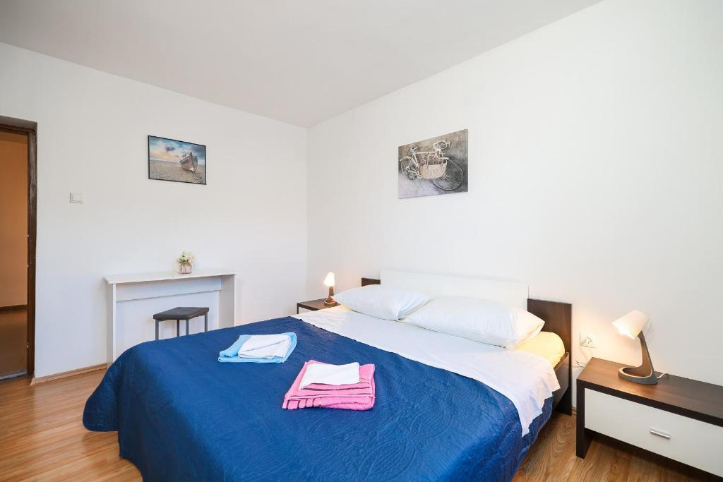 Posteľ alebo postele v izbe v ubytovaní Apartments Feliks