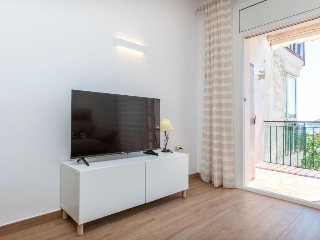 Televízia a/alebo spoločenská miestnosť v ubytovaní Apartment Fané de Dalt by Interhome