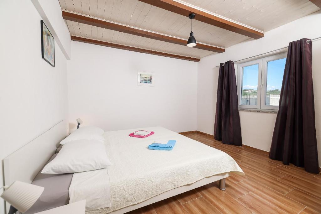Posteľ alebo postele v izbe v ubytovaní Apartments Feliks