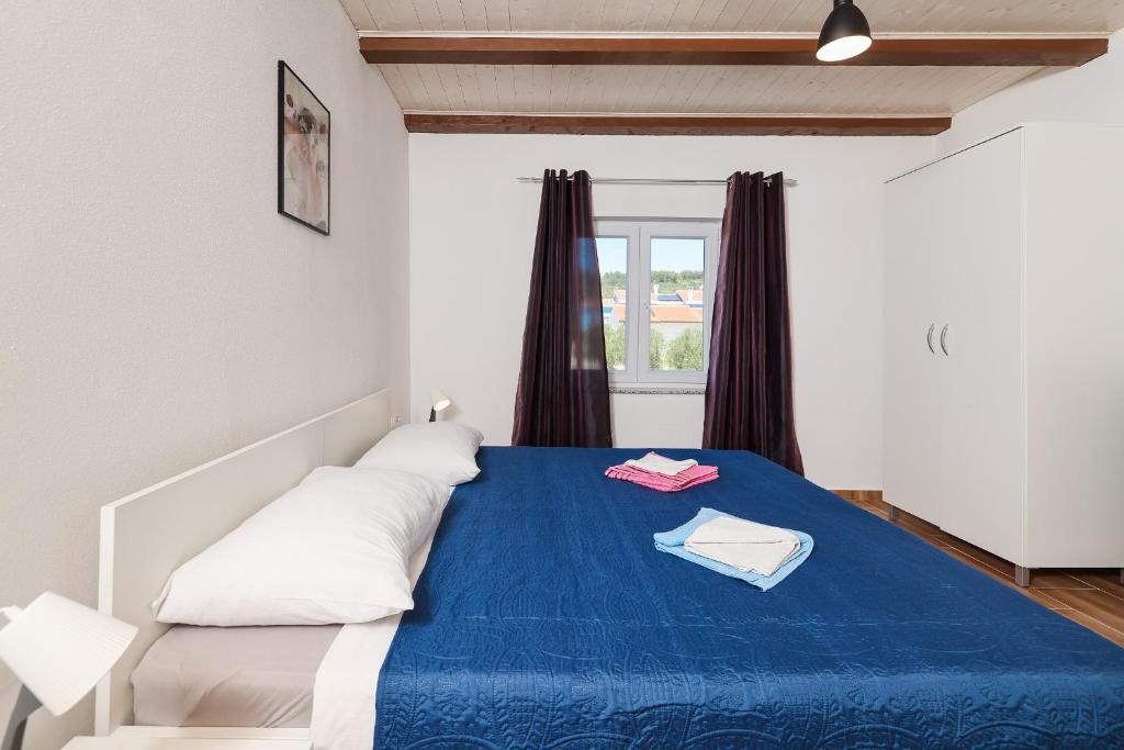 Posteľ alebo postele v izbe v ubytovaní Apartments Feliks