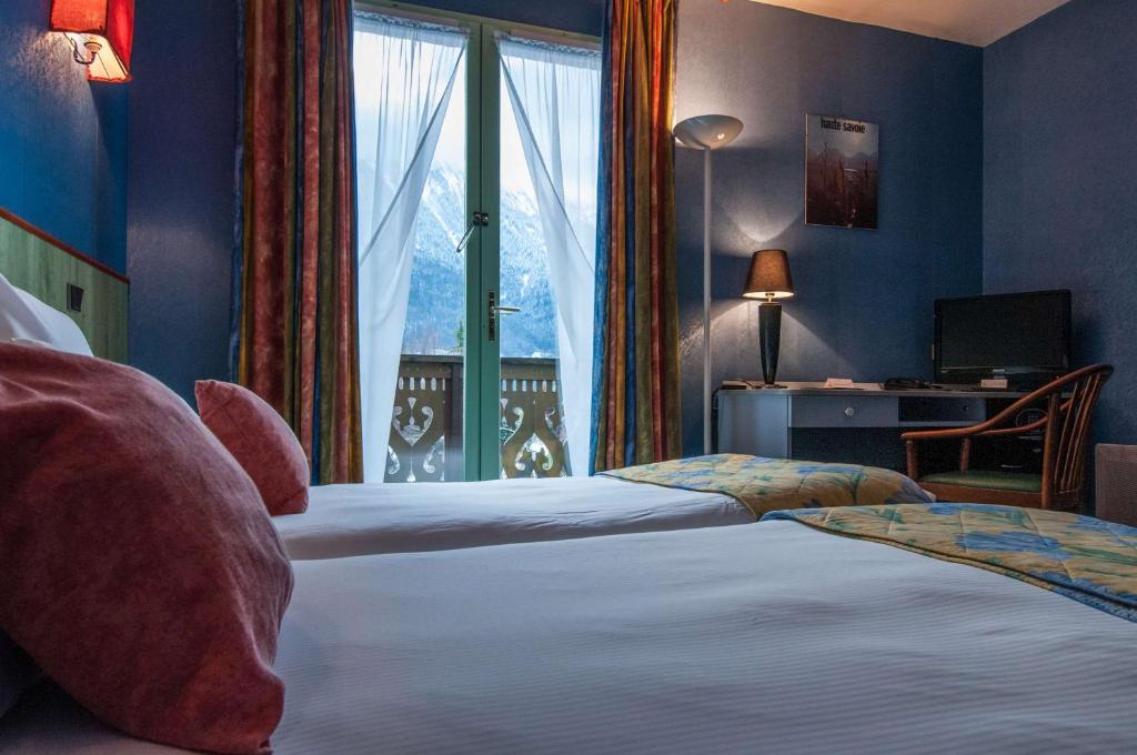 Postel nebo postele na pokoji v ubytování Brit Hotel Florimont