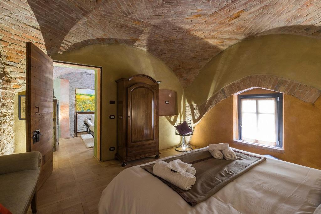 Postel nebo postele na pokoji v ubytování Palazzo d'Assi - Guest house