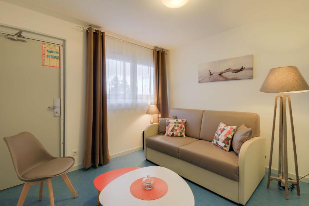 Posezení v ubytování Brit Hotel Dijon Hermes