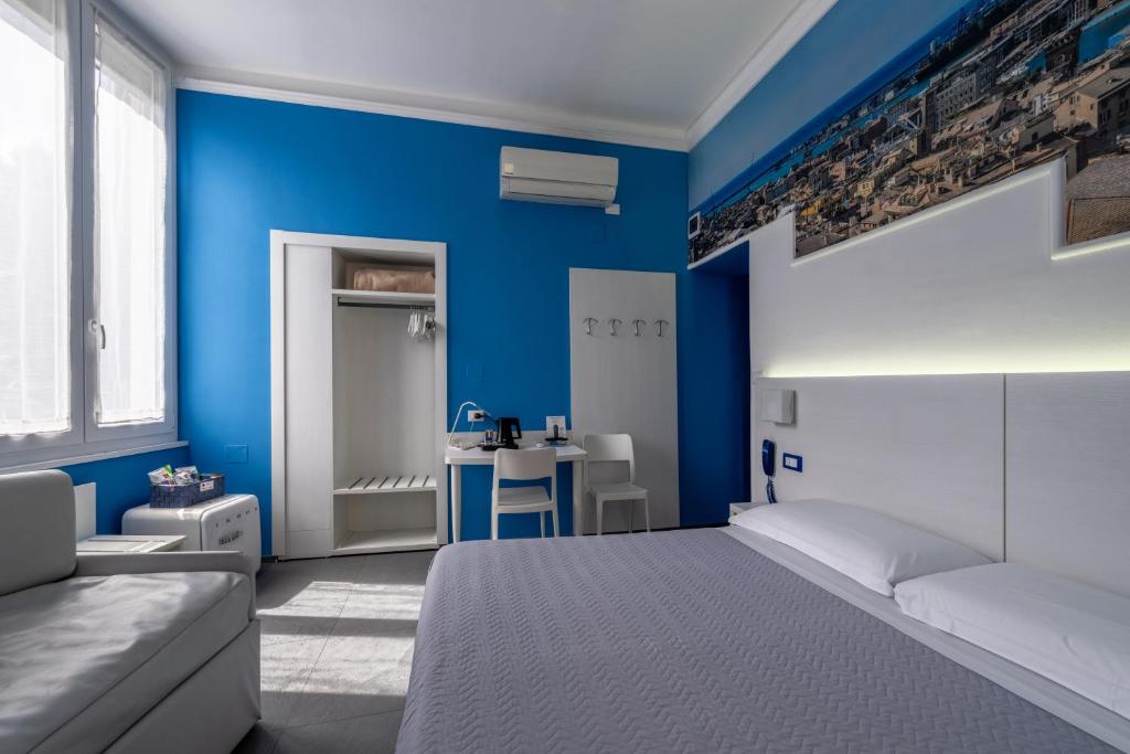 Postel nebo postele na pokoji v ubytování Hotel Fiume