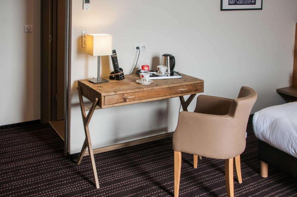 Postel nebo postele na pokoji v ubytování Le Lodge Brit Hotel Strasbourg Zenith