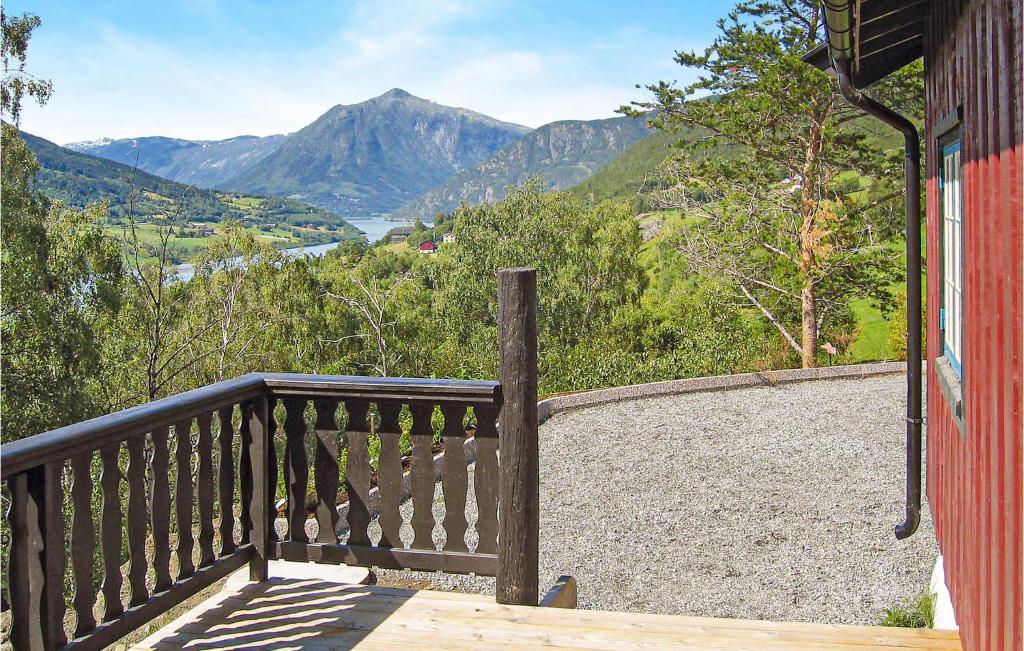 a wooden balcony with a view of a mountain at Awesome Home In Lom With Wifi in Lom