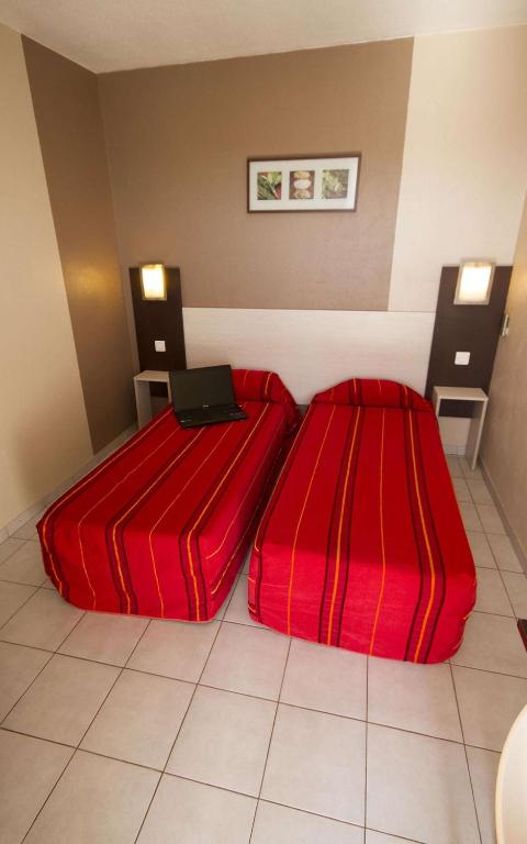 Postel nebo postele na pokoji v ubytování Brit Hotel Essentiel Sète / Balaruc