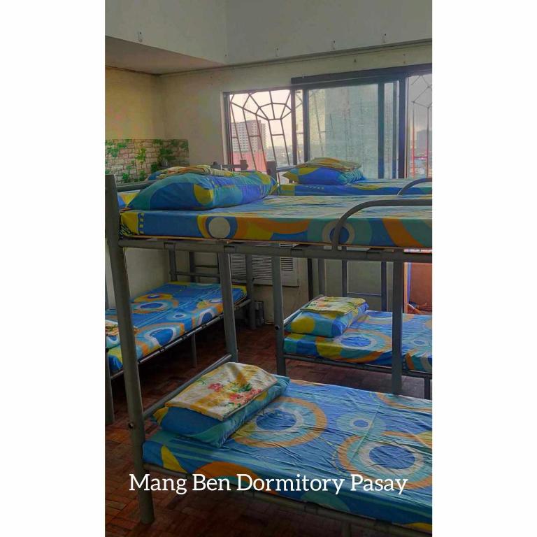 Postel nebo postele na pokoji v ubytování Mang Ben Dormitory Pasay