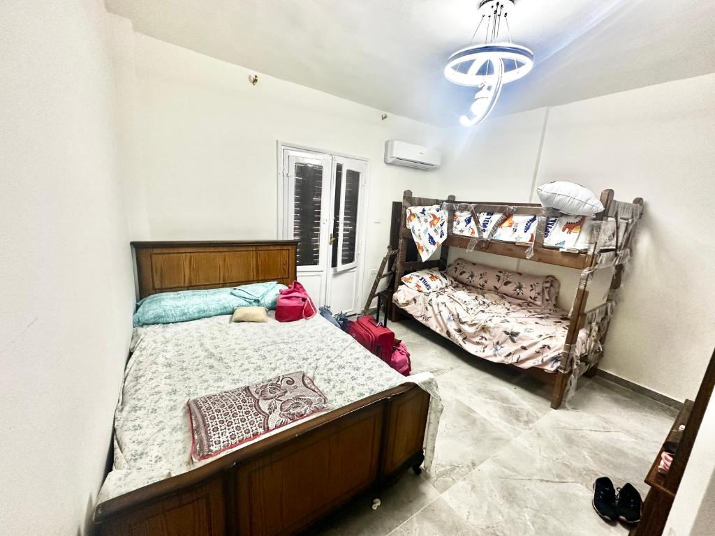 Postel nebo postele na pokoji v ubytování Duplex Luxury 3 Rooms Villa El Karma Sidi Abdelrahman Families ONLY
