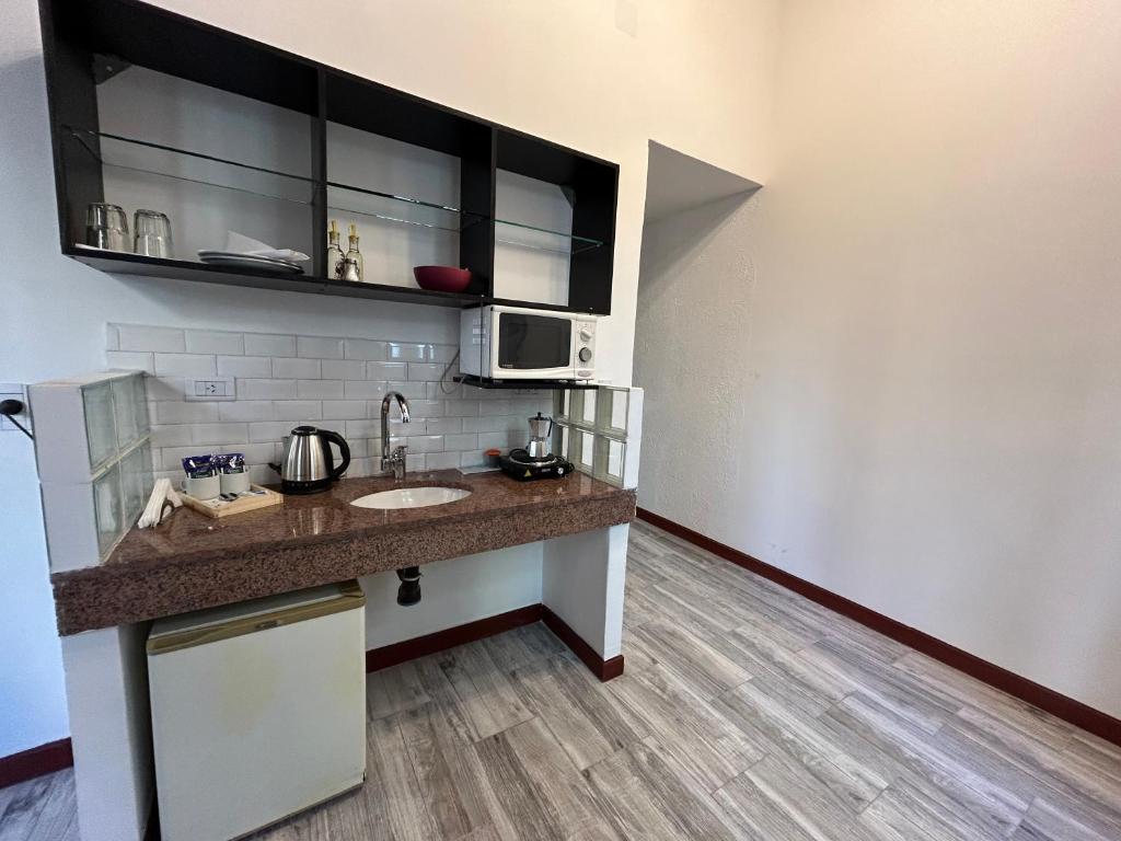 Kuchyň nebo kuchyňský kout v ubytování Hotel Lua