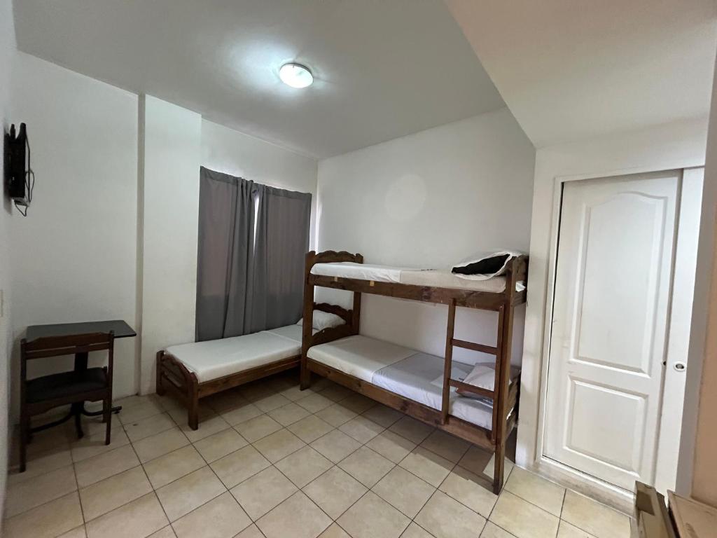 Postel nebo postele na pokoji v ubytování Hotel Lua