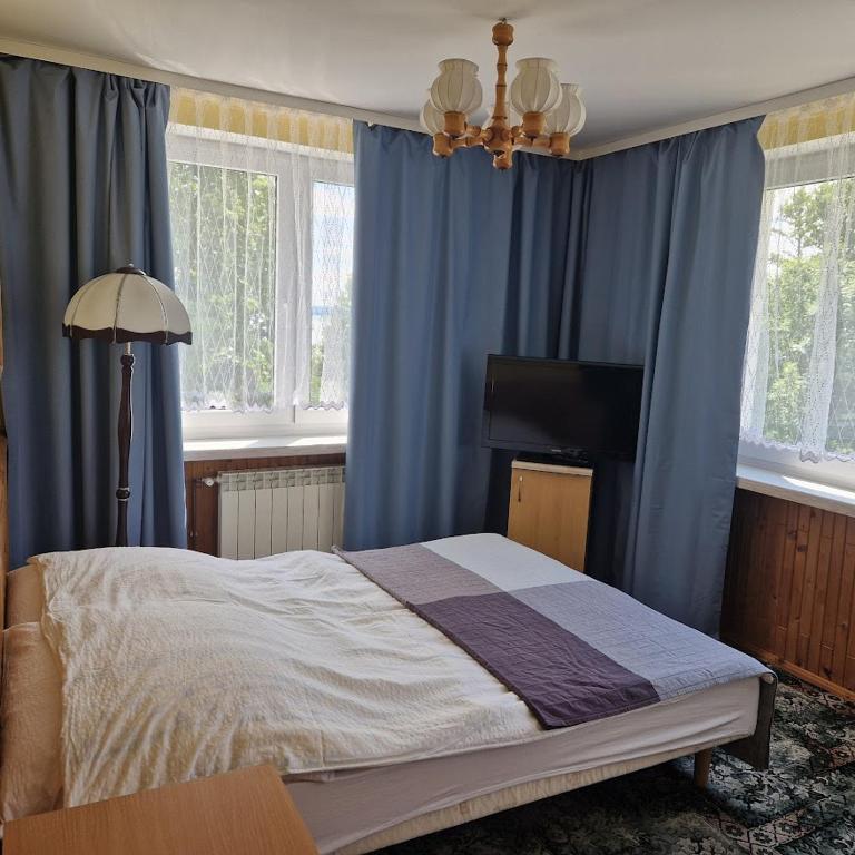 Postel nebo postele na pokoji v ubytování Dom Wczasowy Orka