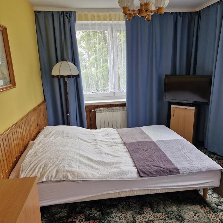 Postel nebo postele na pokoji v ubytování Dom Wczasowy Orka