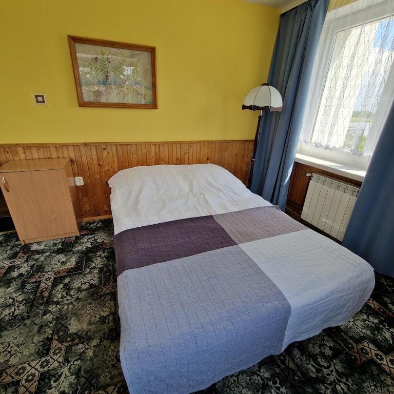 Postel nebo postele na pokoji v ubytování Dom Wczasowy Orka