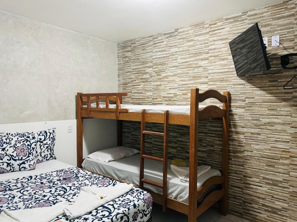 Postel nebo postele na pokoji v ubytování Ilha Bela Pousada